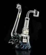 This dab rig is perfect for dabbing your favorite shatter. With its quartz nail you can enjoyably heat your waxes for a great experience. 3D Glass art blown in USA. Sherlock styled body and colorful base. 